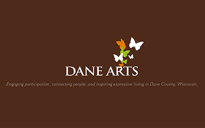 Three color, reverse, one line Dane Arts logo with full tag line